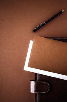 Productivity, work and corporate lifestyle concept - Vintage business briefcase on the office table desk, flatlay background