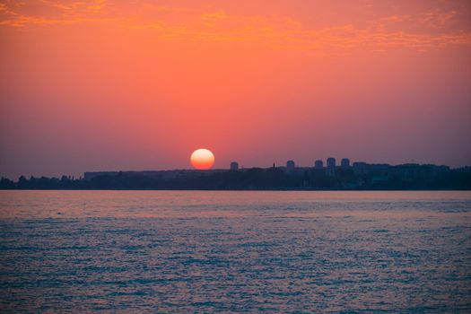 Sunset over a seaside town. Sukhumi, Abkhazia