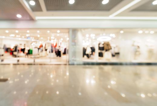 Shopping mall blur background with bokeh. Blurred hall of shopping mall as background.