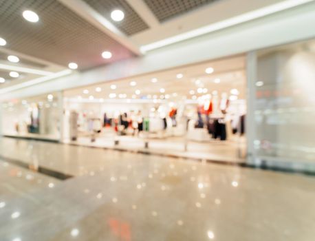 Shopping mall blur background with bokeh. Blurred hall of shopping mall as background.