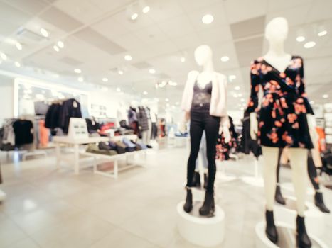 Blur image of clothes and mannequins in clothing store as background