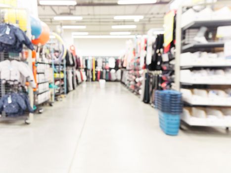 Abstract blurred sport and travel hypermarket aisle with colorful shelves as background