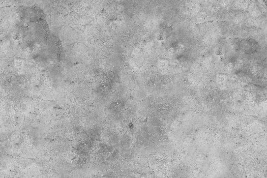 Gray concrete wall with cracks and roughness on the surface