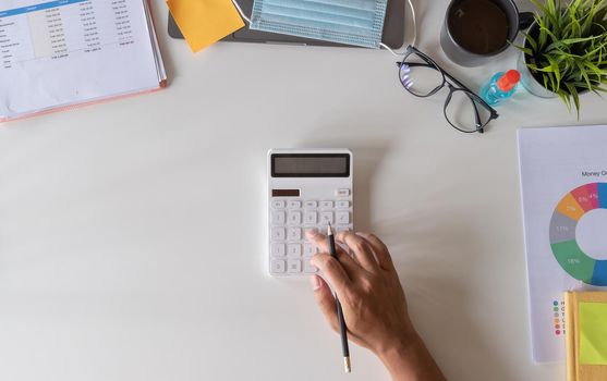 business, accounting and freelance concept - Man working calculator, papers for financial tax at office