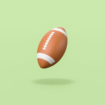 American Football Ball Isolated on Flat Green Background with Shadow 3D Illustration