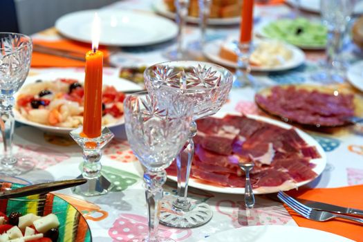 Ornately set table with spanish ham