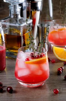 Cocktail Cranberry Orange Bourbon Smash with a spicy hint of thyme