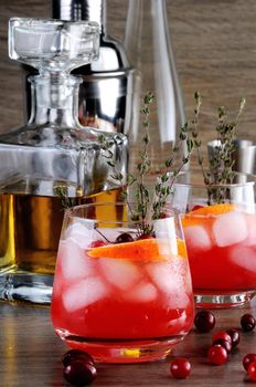 Cocktail Cranberry Orange Bourbon Smash with a spicy hint of thyme