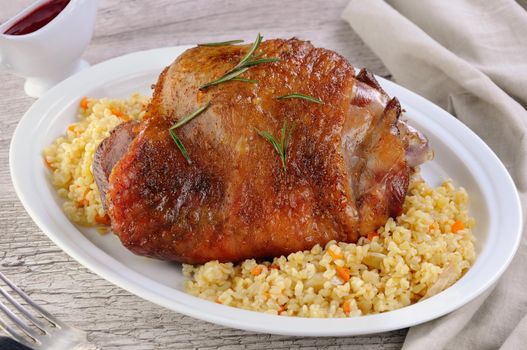 Baked turkey thigh with garnish bulgur and vegetables 