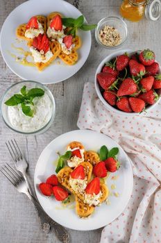  Delicate, melting  mouth-watering  Belgian waffles with whipped cream, strawberries, flavored with peanuts and honey. What could be better for breakfast.