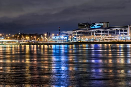 Hotel Moscow on the Sinopskaya embankment of the Neva River. Russia, Saint Petersburg, night landscape