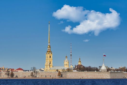 Peter and Paul Fortress on the Neva River. Russia, Saint Petersburg cityscape against the blue sky