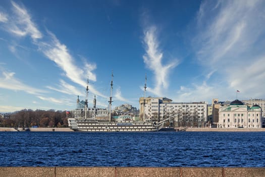 The old sailing ship Kronverg is moored at the embankment of the Neva River. Russia, Saint Petersburg cityscape