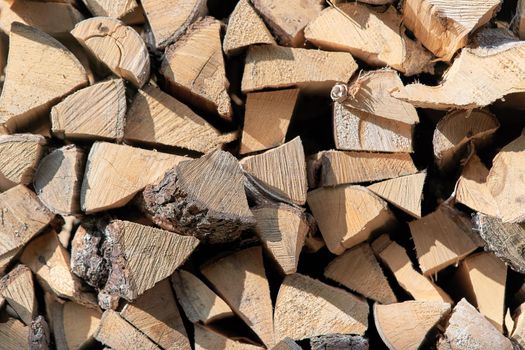 View of the woodpile, the ends of the pieces of wood. Background and texture