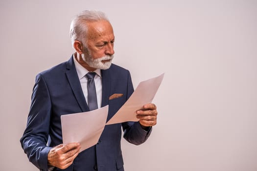 Portrait of serious and pensive senior businessman.