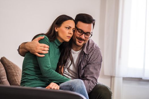 Woman is angry on her man. He is trying to apologize.