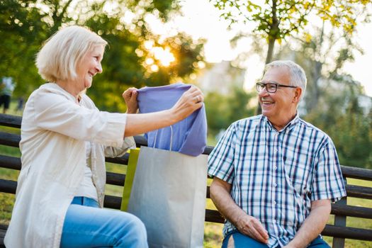 Senior woman is getting gifts from her man.