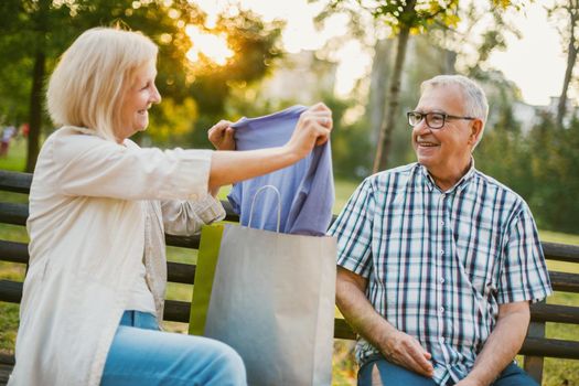 Senior woman is getting gifts from her man.