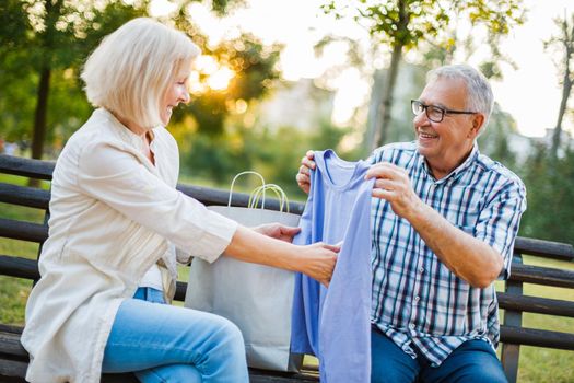 Senior woman is getting gifts from her man.