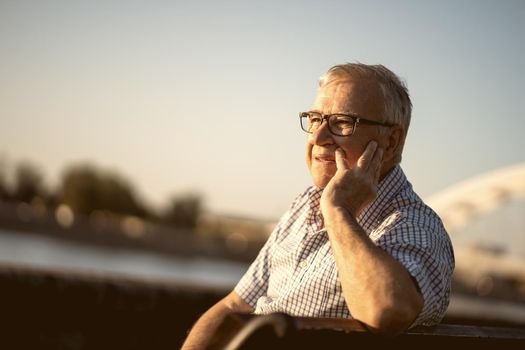 Outdoor portrait of worried and depressed senior man.