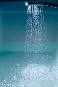 shower filling a bathtub with water stream