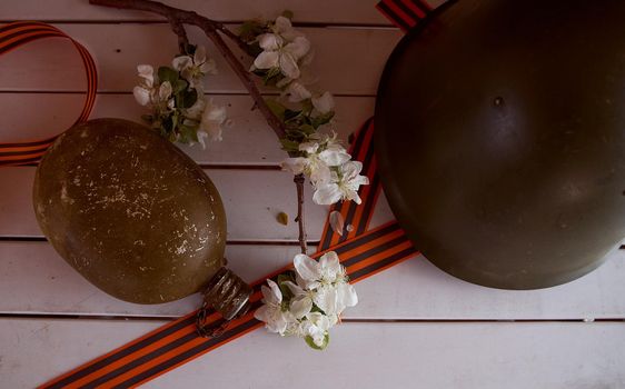 Soldier's flask with St. George ribbons. Victory Day Photos. High quality photo