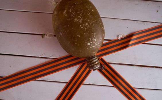 Soldier's flask with St. George ribbons. Victory Day Photos. High quality photo