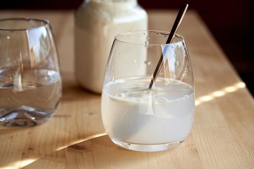 Preparation of a a healthy drink from whey protein and water in a glass