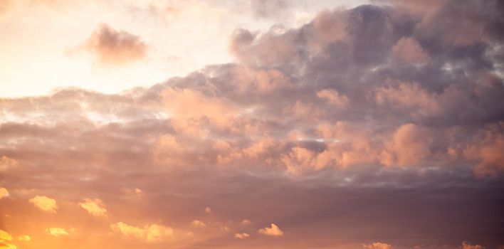 Dramatic sky with orange clouds over the city before dawn or sunset. Weather before or after a storm.