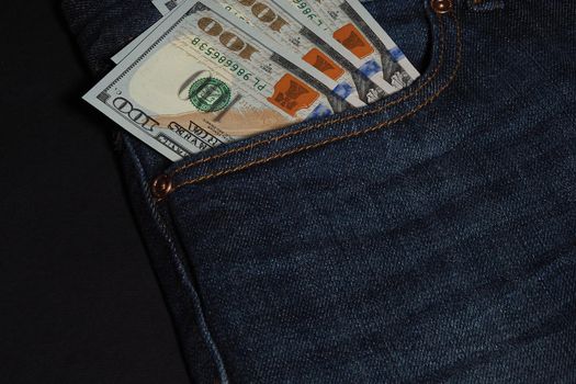 American dollar in a pocket in jeans. Paper banknotes, currency. High quality photo