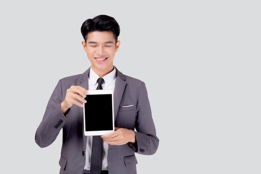 Portrait young asian business man showing and presenting tablet computer with blank with success isolated on white background, businessman standing and holding touchpad digital, communication concept.