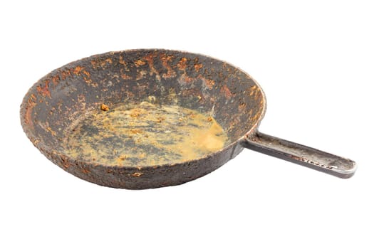 old disgusting stained rusty cast iron pan with burnt fat and food leftovers isolated on white background
