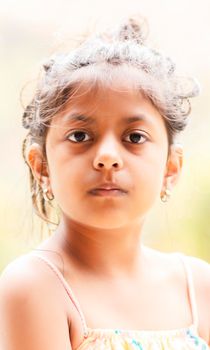 Portrait of cute little girl showing her beautiful face