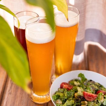 Beer glasses with salad close up