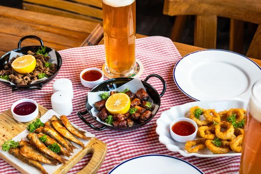 Tasty meat meal roulette with lemon, sprat and beer