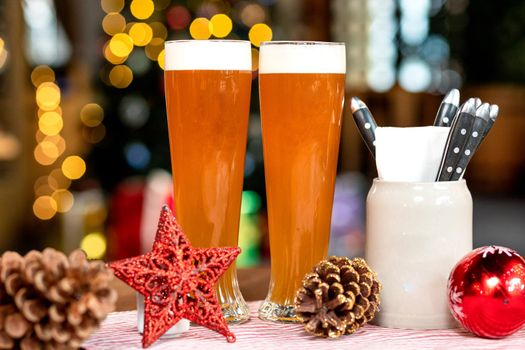 Beer drink glasses, mugs with christmas, new year toys, decorations, gifts with bokeh background