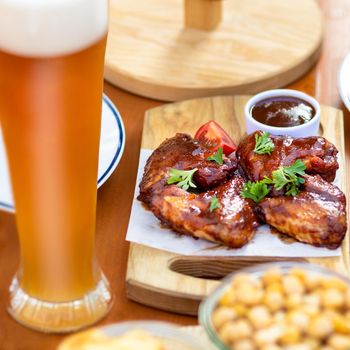 Barbecue chicken meal with beer and sauce