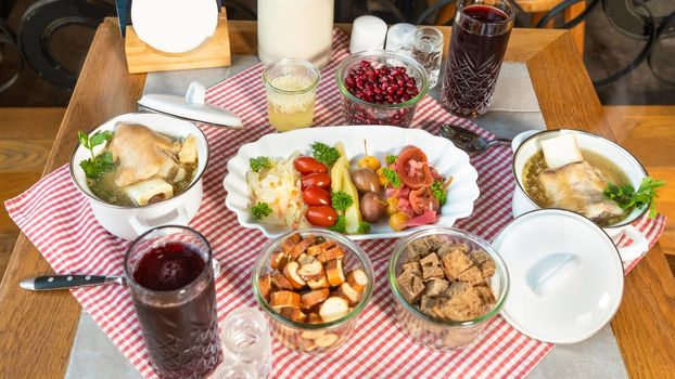 Pomegranate juice with vodka meat meals and snacks, top view