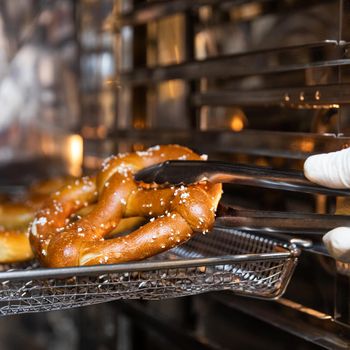 Worker taking out Pretzel