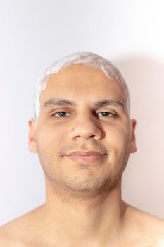 Man Shaving His Head Using White Foam