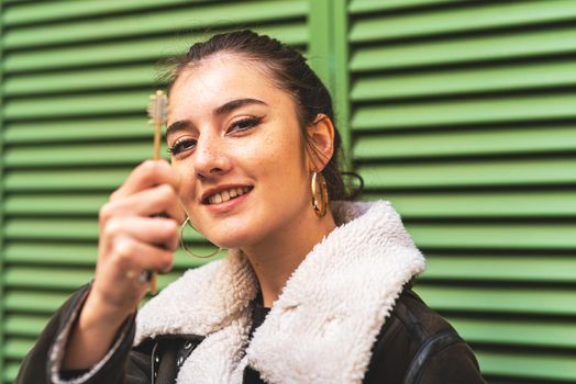 young woman with his new real estate key