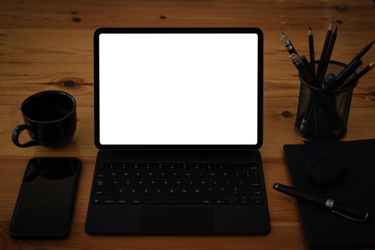 White blank screen digital tablet on modern working desk