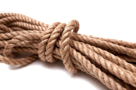jute rope is isolated on white background. Selective focus