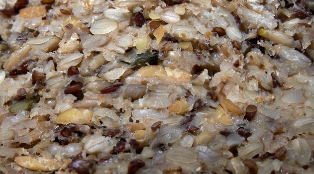 Slice of bread with sunflower seeds, linseed. Close-up