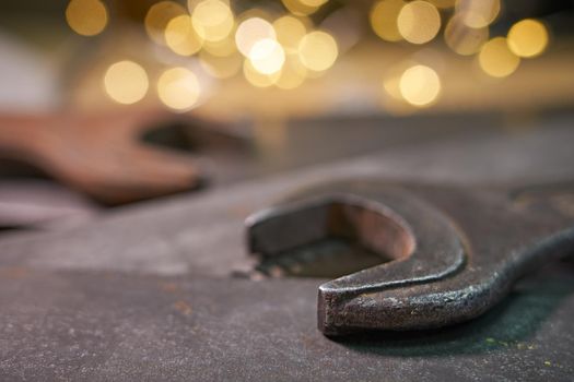wrenches and hacksaw blades lie on a metal sheet.Soft selective focus