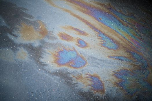 Beautiful abstract colorful background, texture, stains from engine oil on the asphalt.Colorful gas stain on wet asphalt.Soft selective focus
