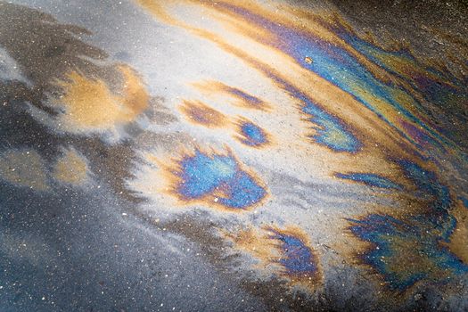 Beautiful abstract colorful background, texture, stains from engine oil on the asphalt.Colorful gas stain on wet asphalt.Soft selective focus