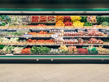 Fresh vegetables on shelf in supermarket for background