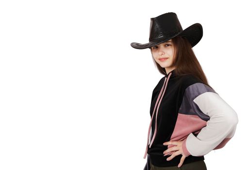 teenage brunette girl posing with black hat in studio on white background