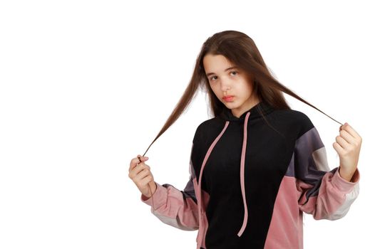 portrait of teenage brunette girl posing in studio on white background